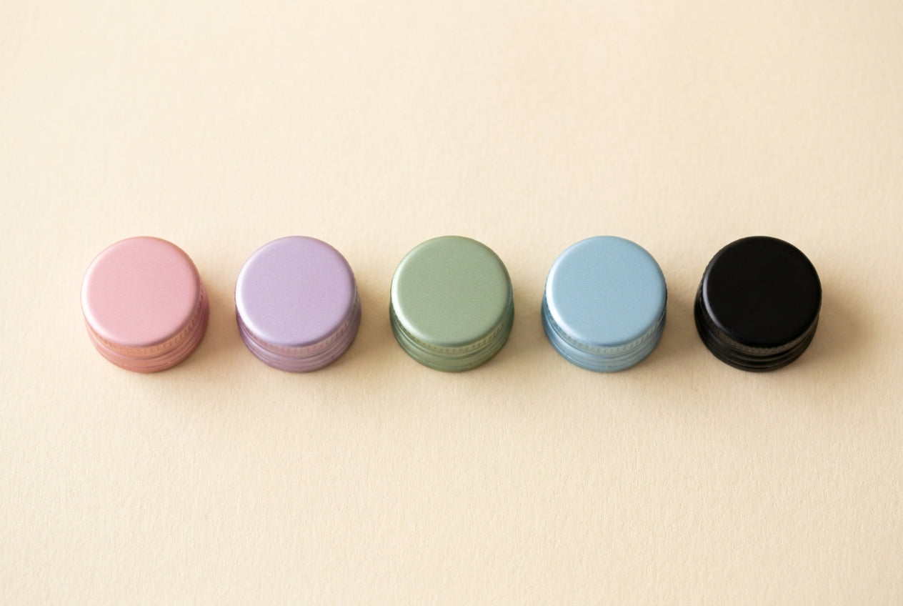 Pastel bottle caps lined up in a row