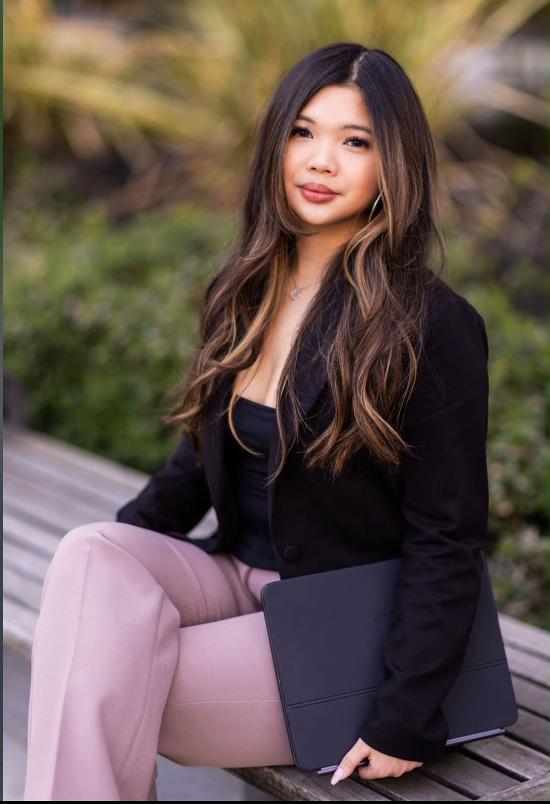 Founder of Aura seated outdoors